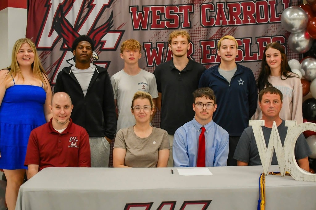 Senior Hayden Wingo with family, coaches, and players