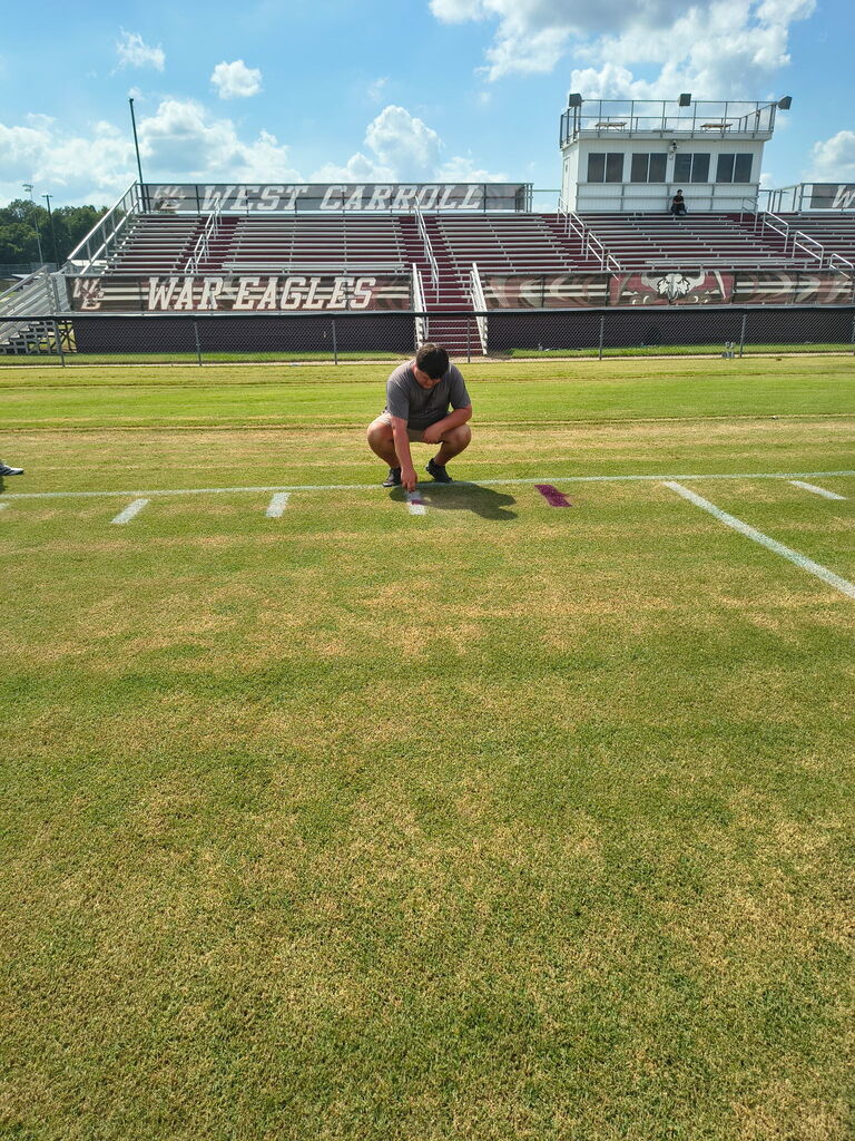 Painting the Tick Marks at the football field 