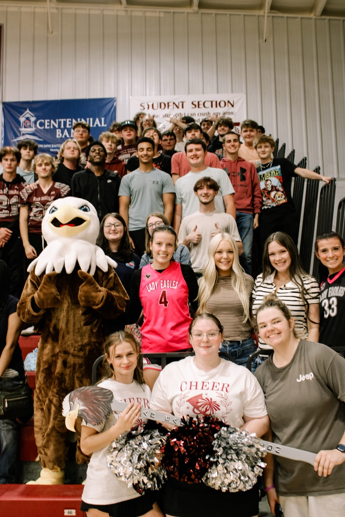 Photos from pep rally featuring cheering student body in the high school gym. 