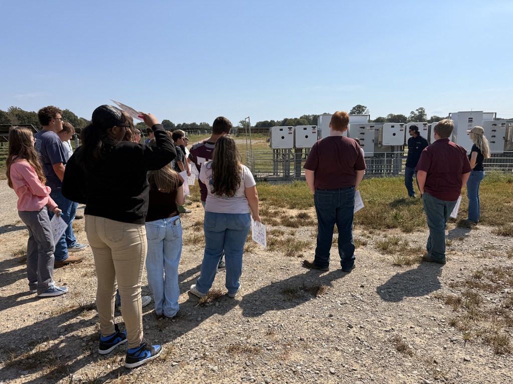 West Carroll students listen as representatives explain electrical equipment during their tour of the Trezevant Solar Farm.
