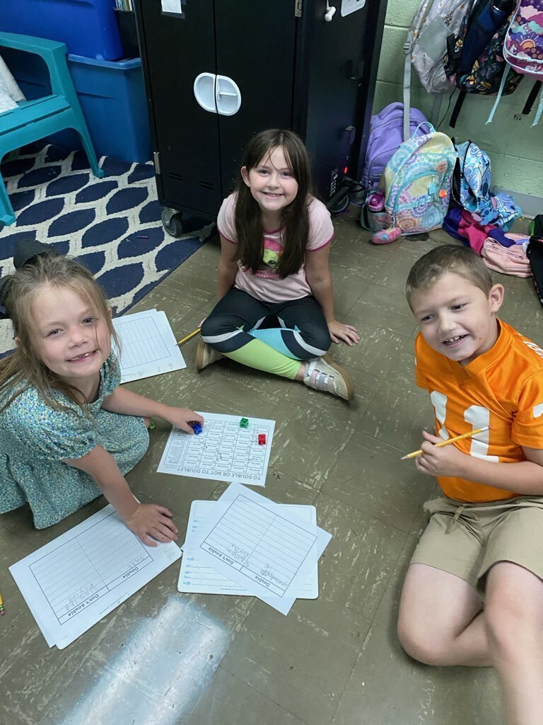 several west carroll primary students learning the rule of doubles in math class