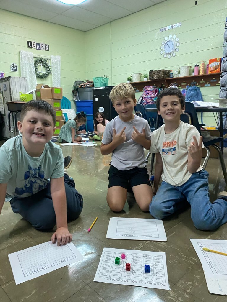 several west carroll primary students learning the rule of doubles in math class