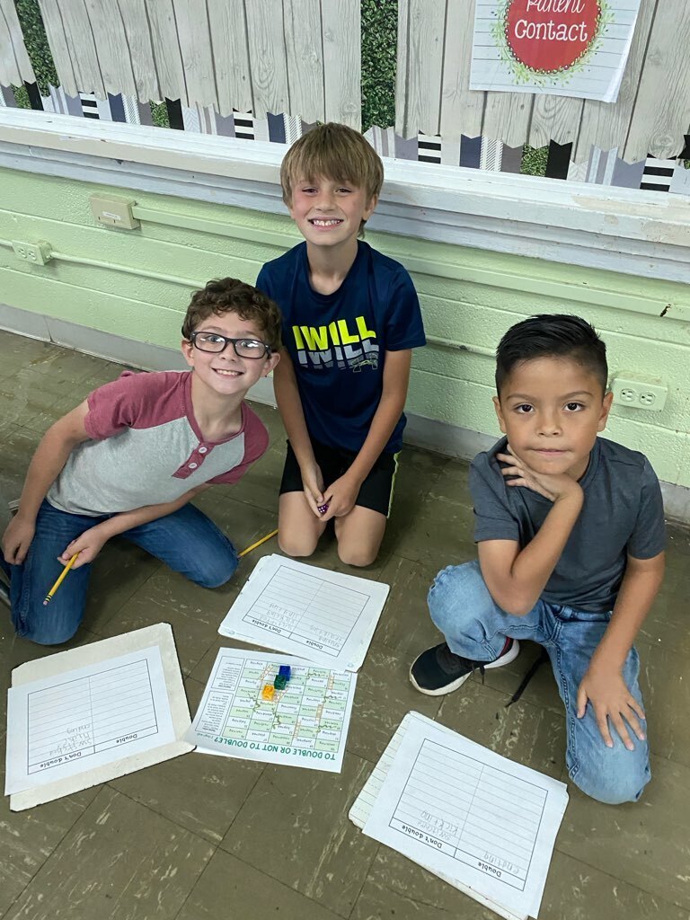 several west carroll primary students learning the rule of doubles in math class
