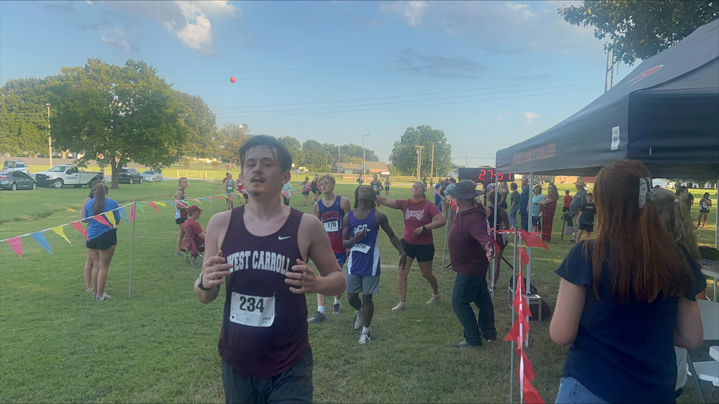 cross country runner as he finishes
