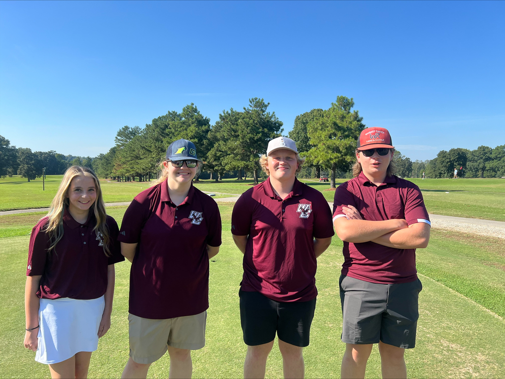members of the West Carroll golf team posing together on the golf course after competition