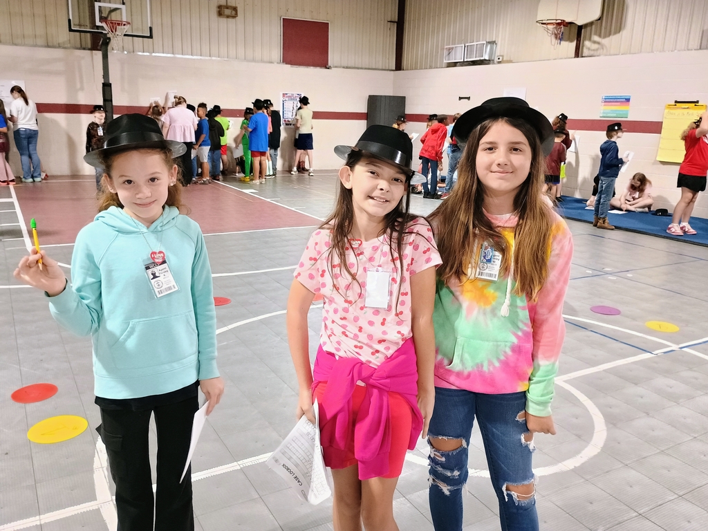 three west carroll students posing during reading mystery celebration wearing detective hats