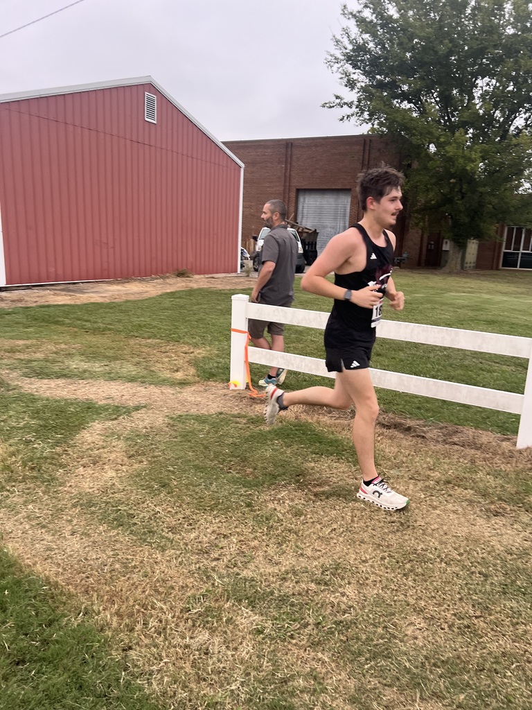 west carroll student competing at cross country meet
