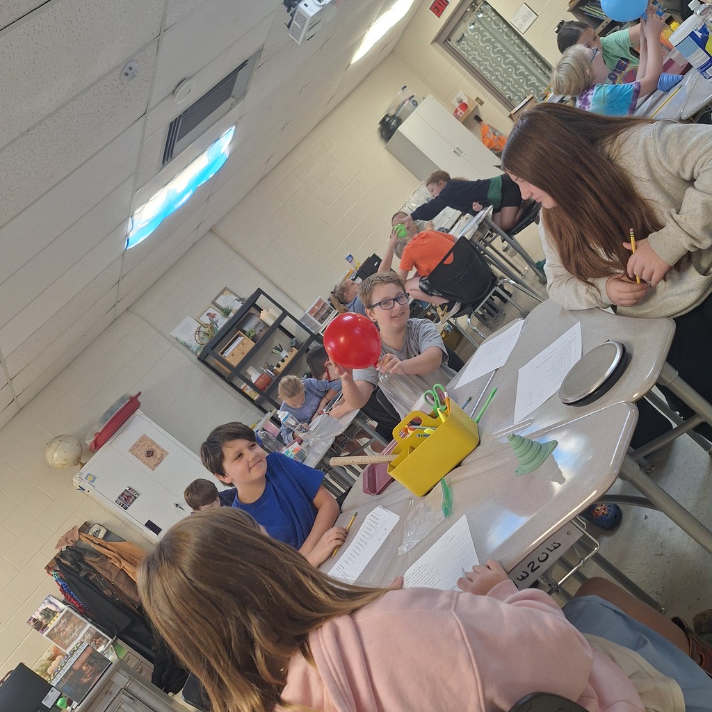 west carroll elementary students performing science experiment about mass conservation