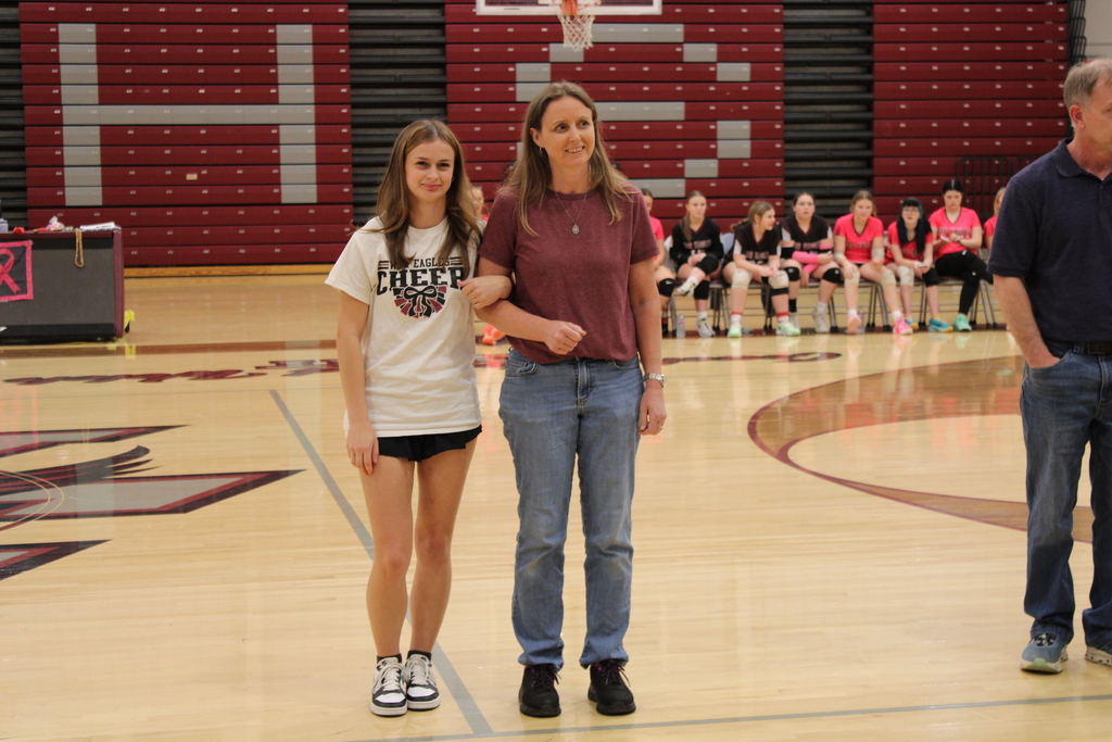 A West Carroll senior athlete stands with family members on the court during Senior Night festivities.