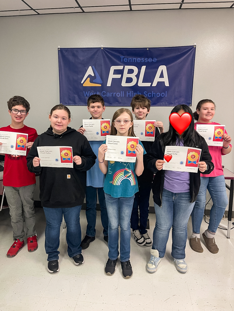 Seven West Carroll 7th grade Exploring Business and Marketing students stand in front of a Tennessee FBLA banner holding certificates recognizing their completion of Canva’s Visual Suite certification.