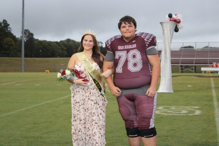 Taytum Jenkins: 2026 Homecoming Queen Taytum Jenkins poses on the field with her escort, Landon Wilson.