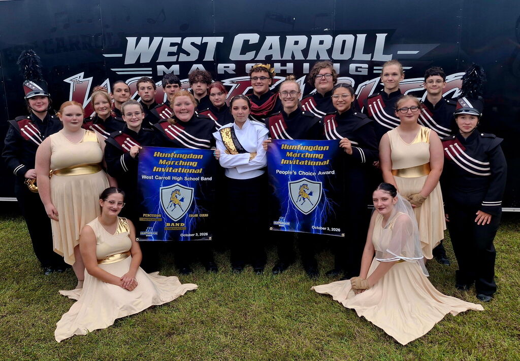 The West Carroll Marching War Eagles pose together following the Huntingdon Marching Invitational. Students hold awards recognizing West Carroll for 1st Place Band, 1st Place Percussion, and the People’s Choice Award.