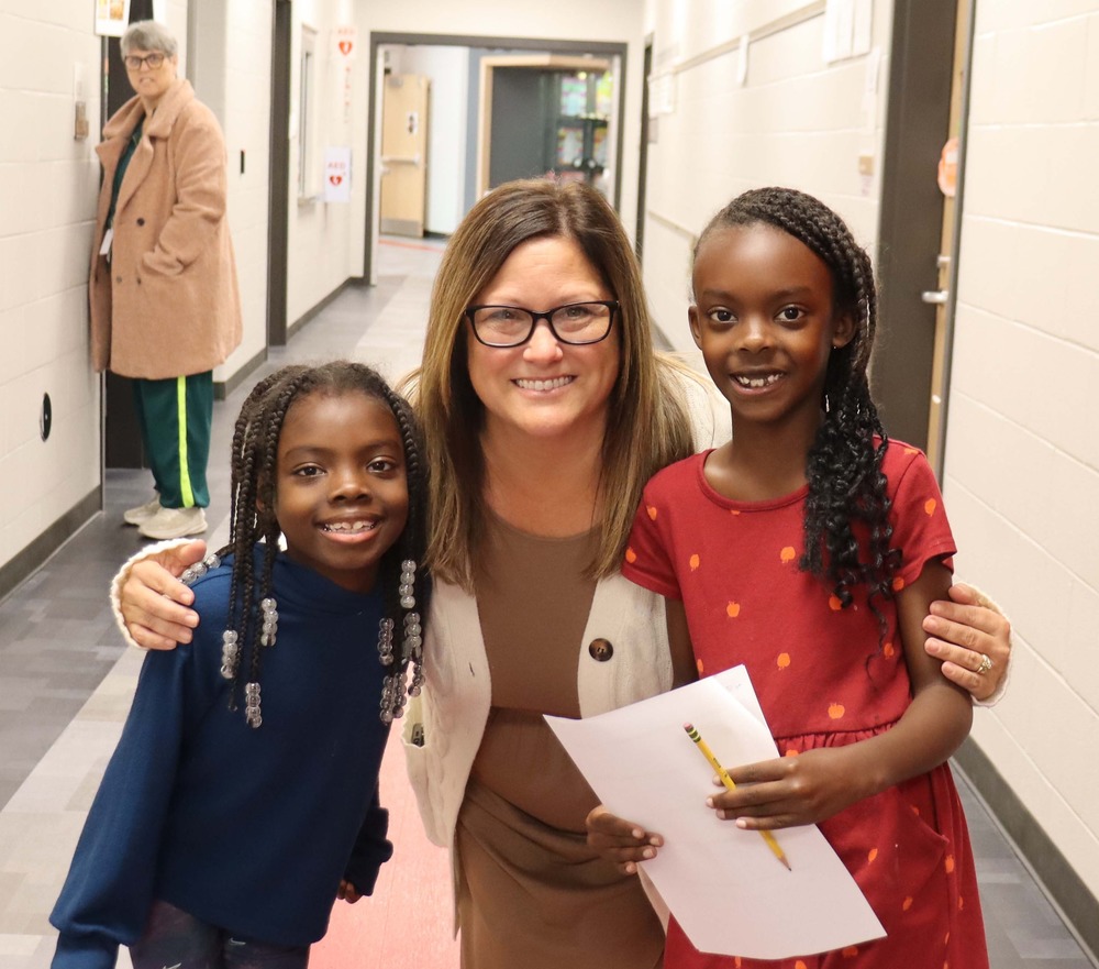 assistant principal with two students
