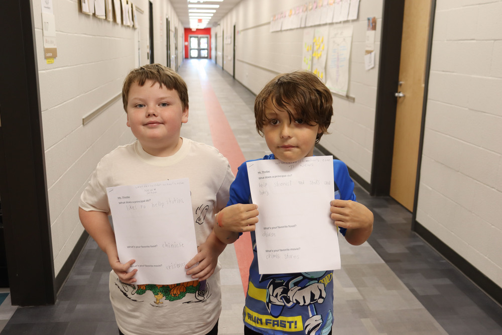 two students with papers