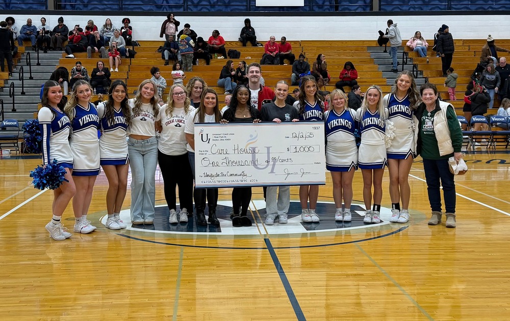 Group of students with $1000 check to Care House