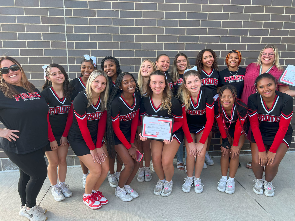 cheerleaders with coaches