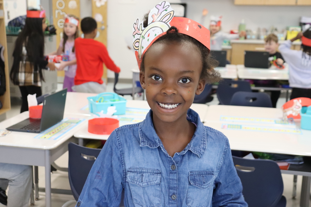 Child with reindeer hat