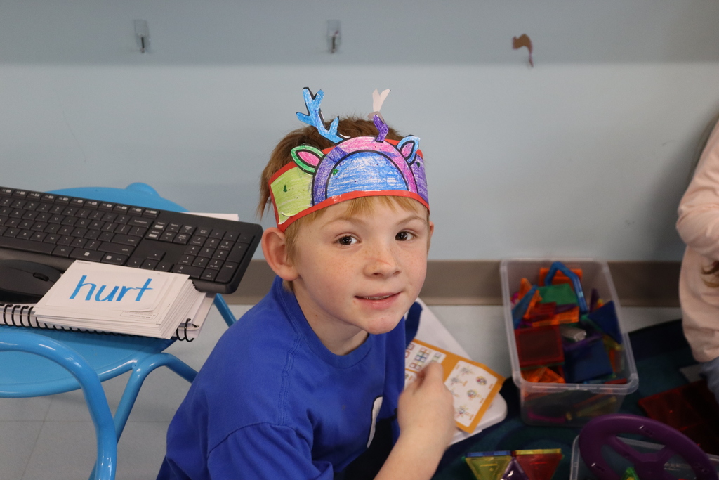 Child with reindeer hat