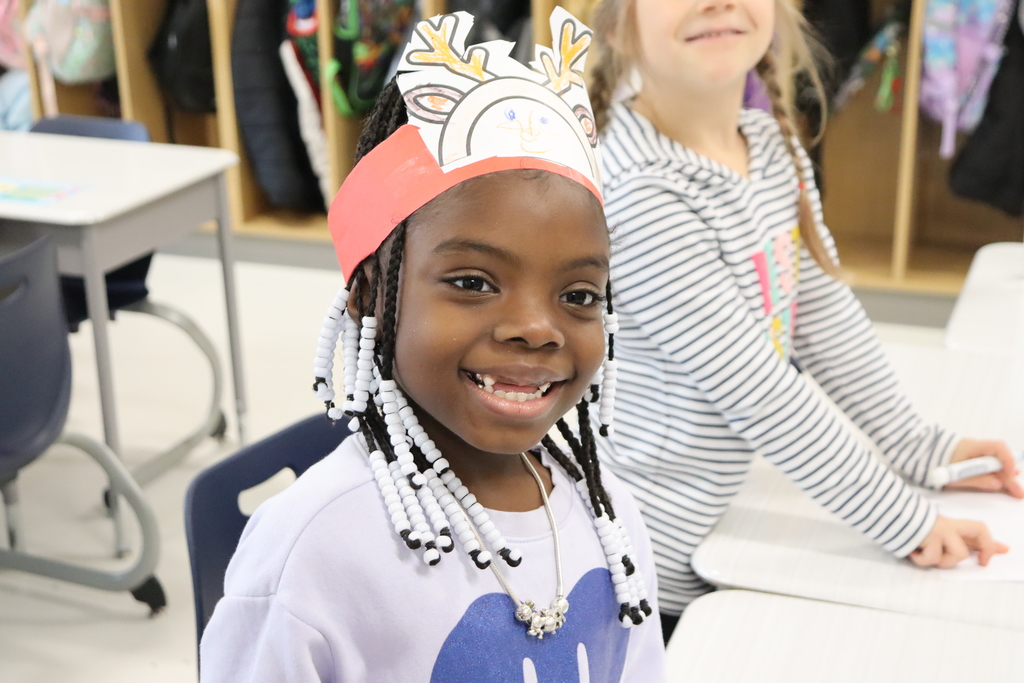Child with reindeer hat