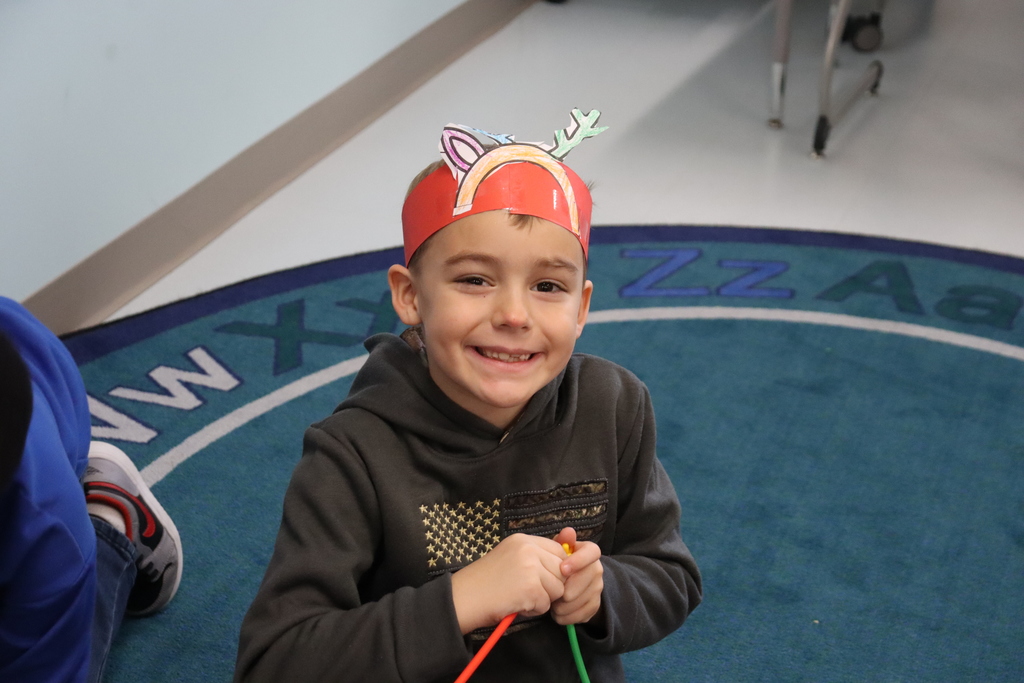 Child with reindeer hat