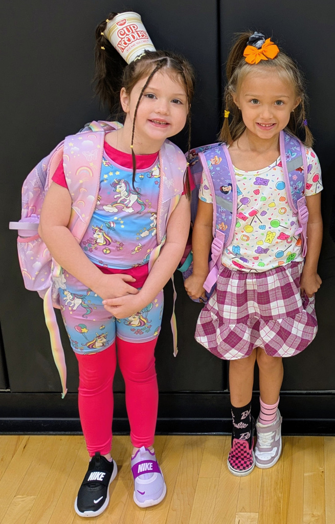 two girls whose shoes do not match