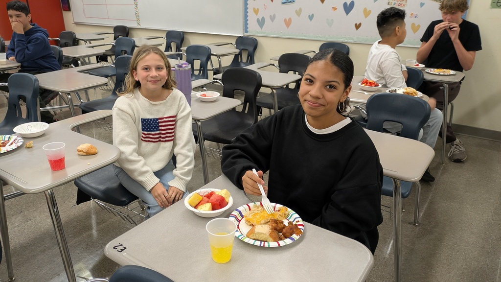 two students eating at desk