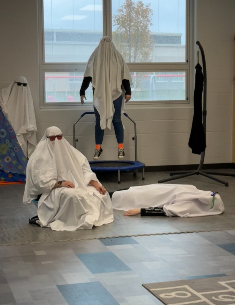 people in ghost outfits