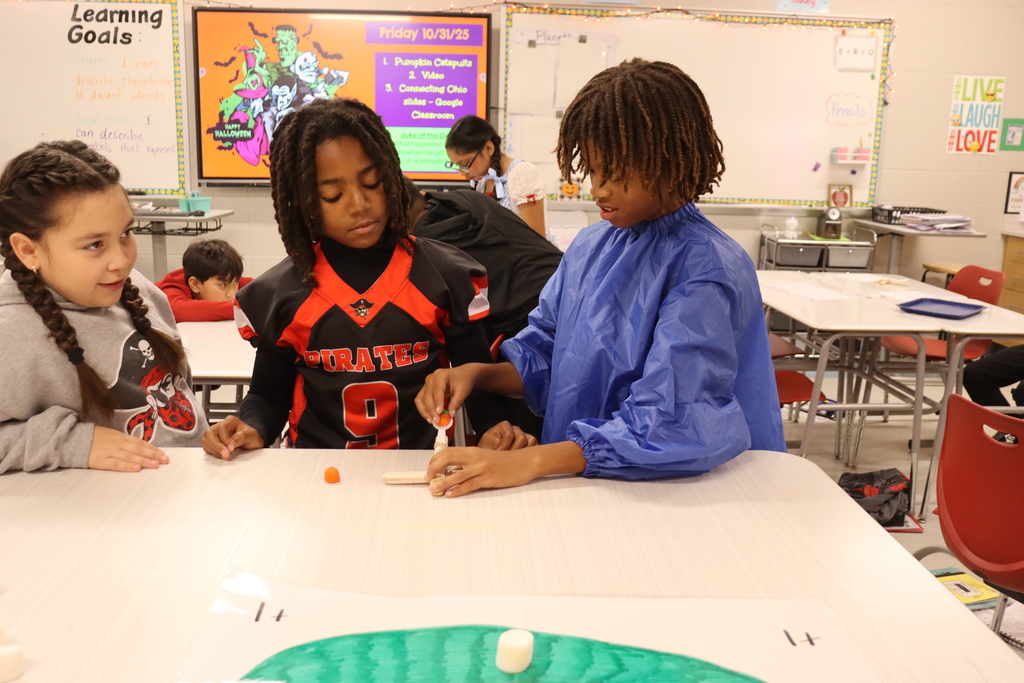 kids catapulting candy onto target