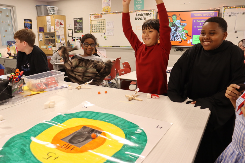kids catapulting candy onto target