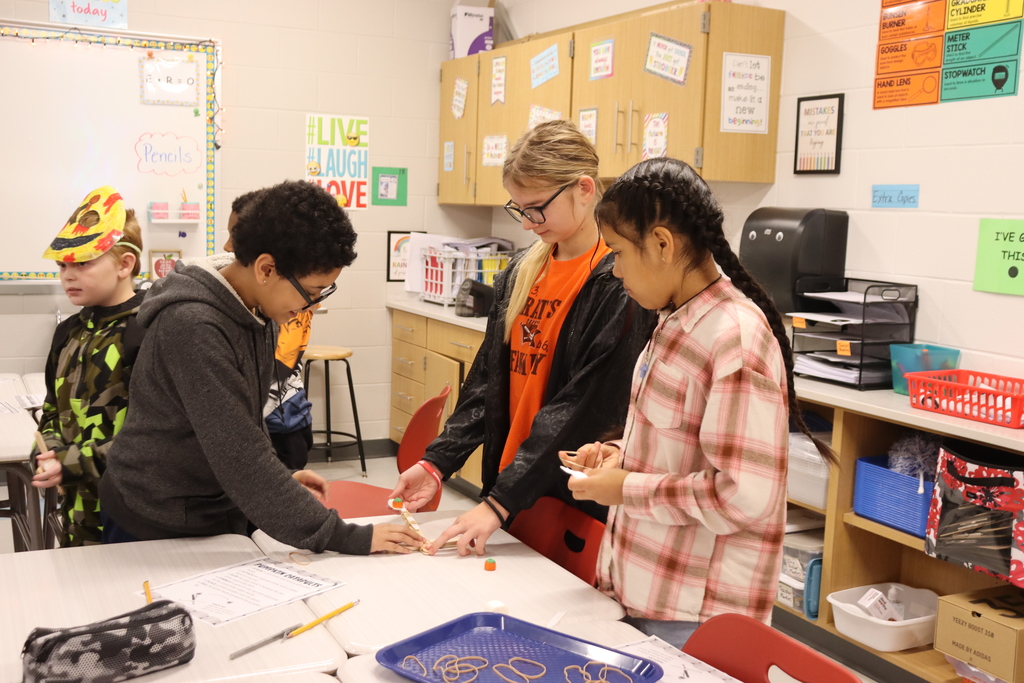 kids catapulting candy onto target