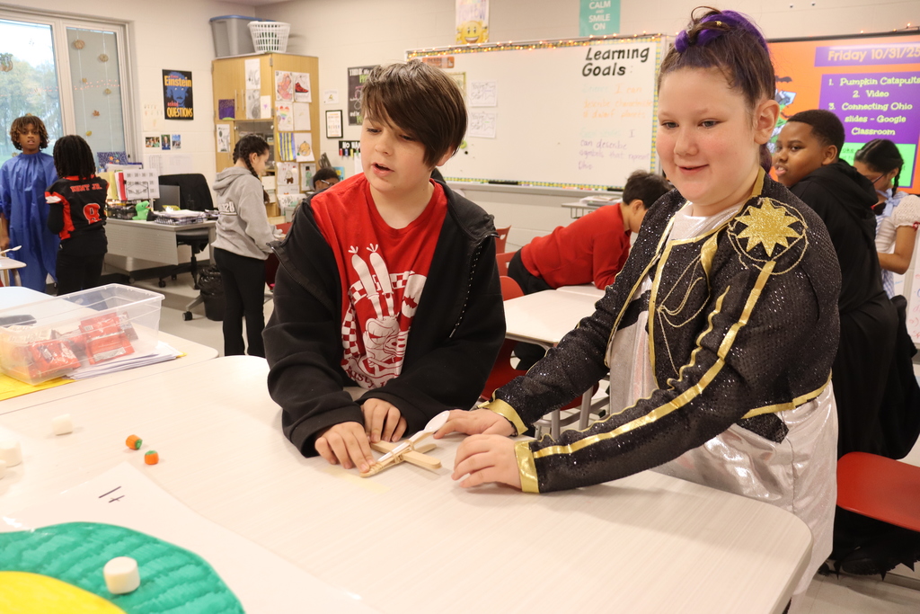 kids catapulting candy onto target