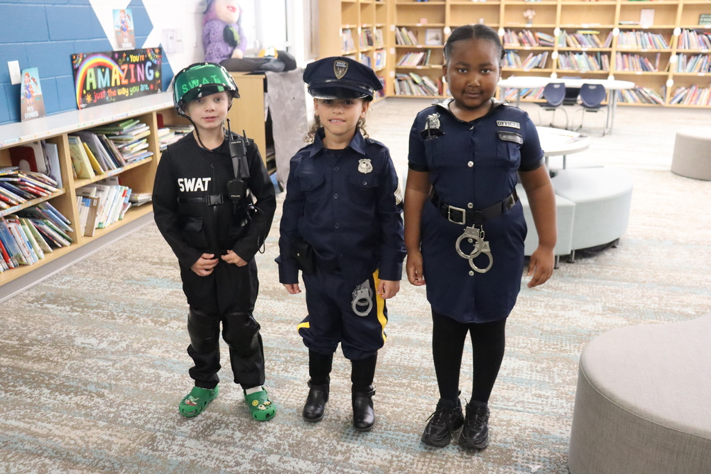 kids dressed as a swat officer and police officers