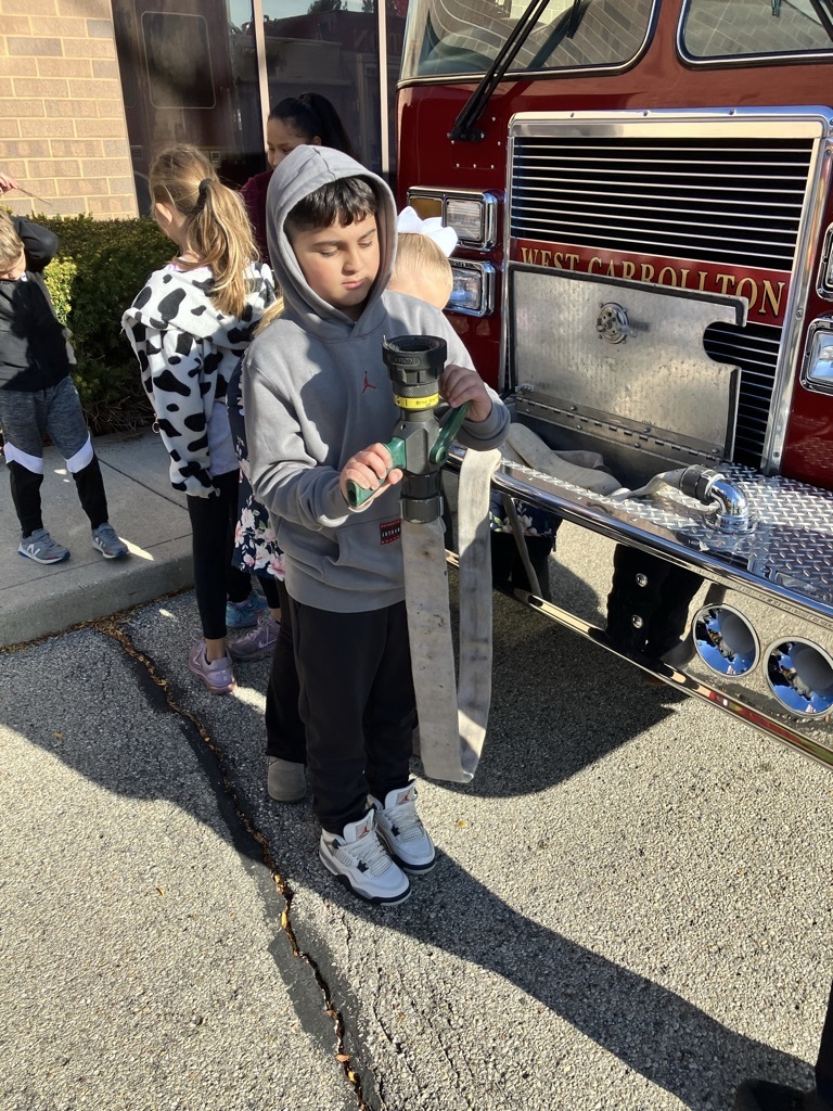 boy holding a fire hose