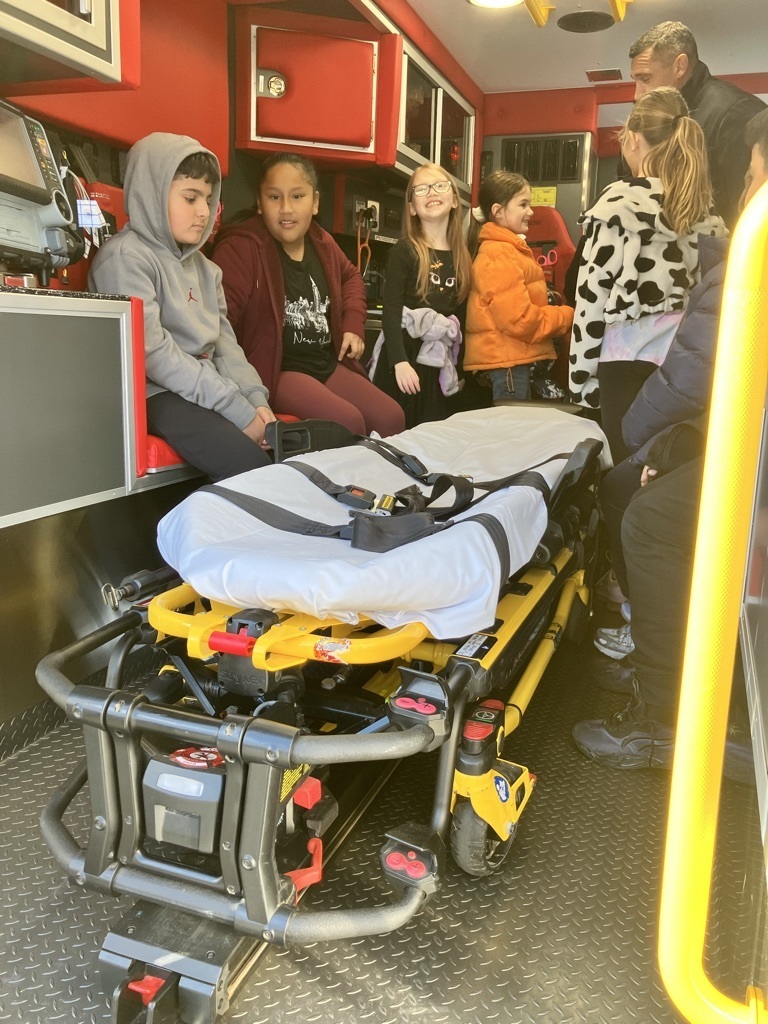 Students in back of an ambulance
