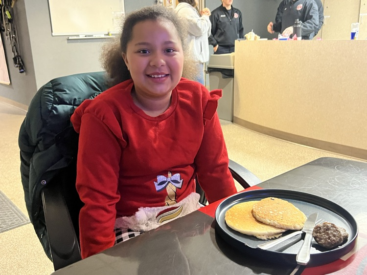 girl eating breakfast