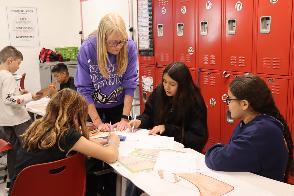 Teacher working with students