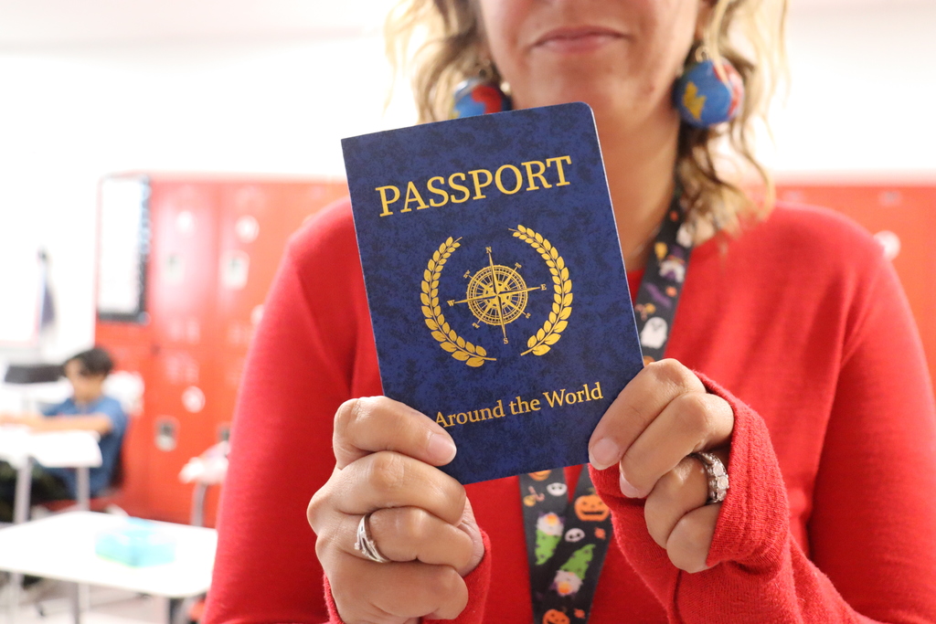 woman holding a classroom passport