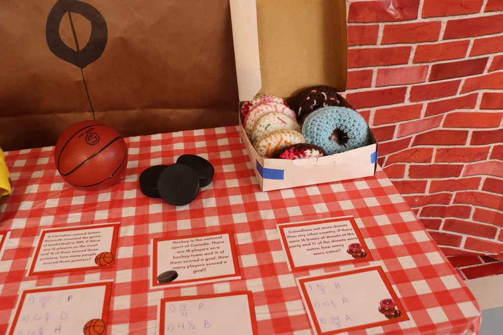 basketball, hockey pucks and donuts on a table