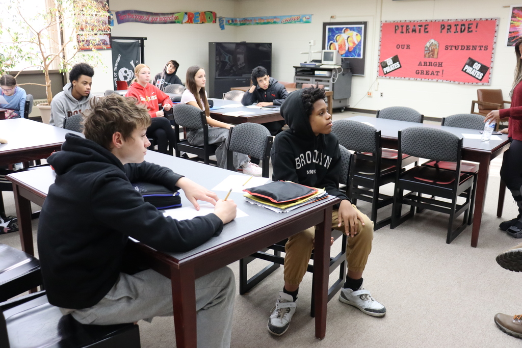 Students listening to guest speakers