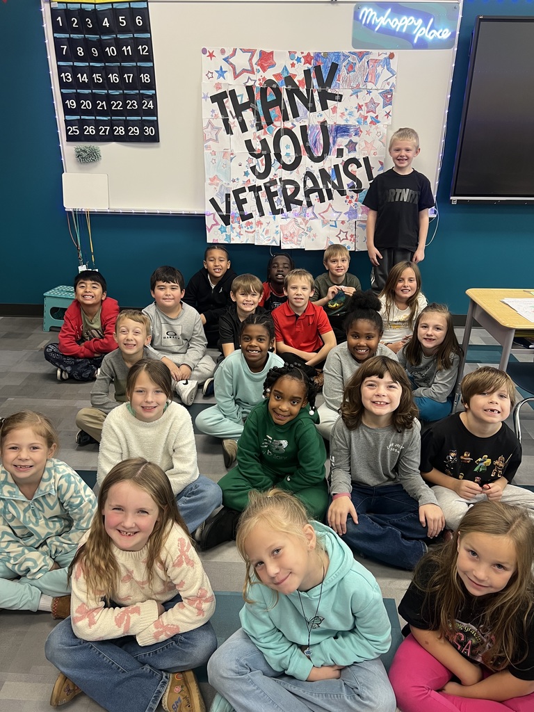 kids in front of thank you veterans poster