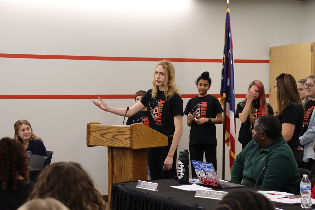 Students making a presentation at the school board meeting