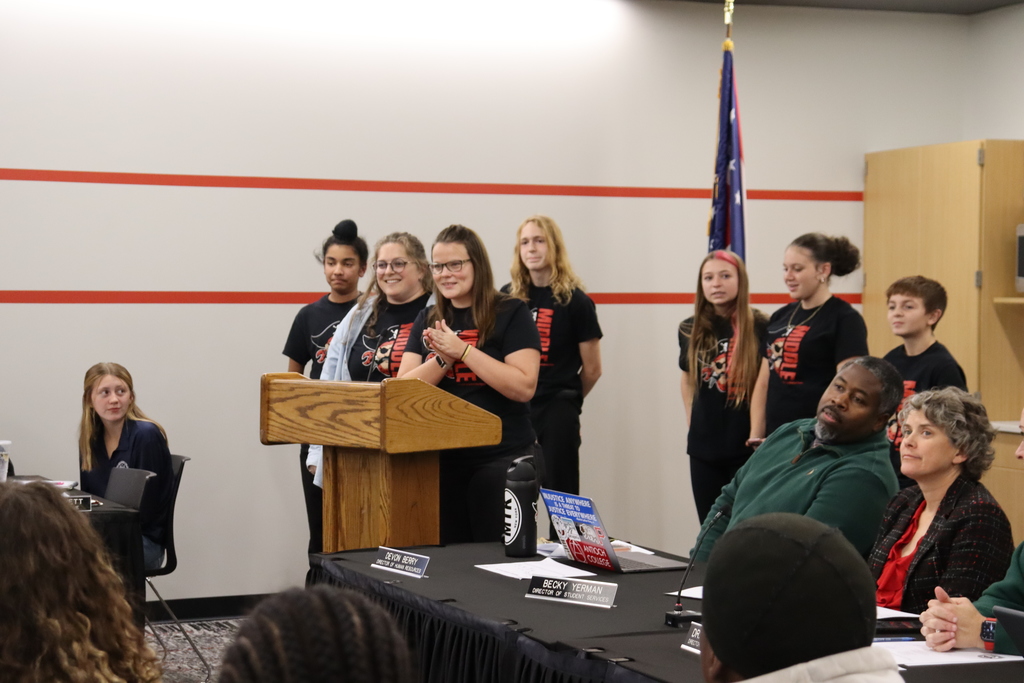 Students making a presentation at the school board meeting
