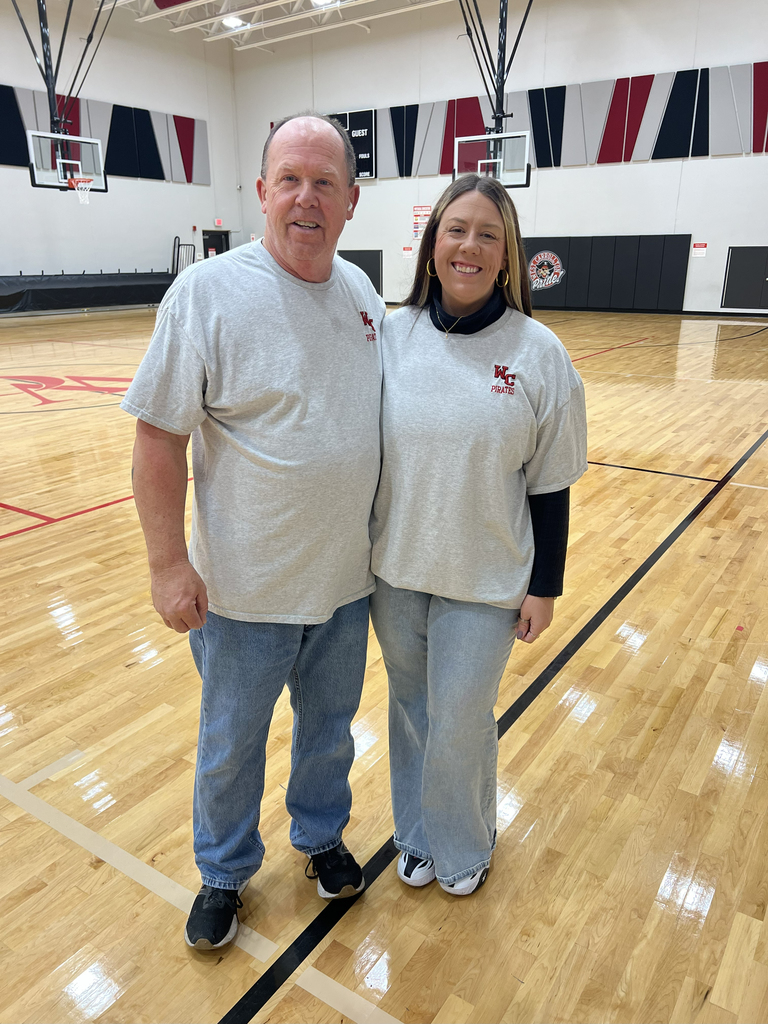 Man and woman in matching shirts
