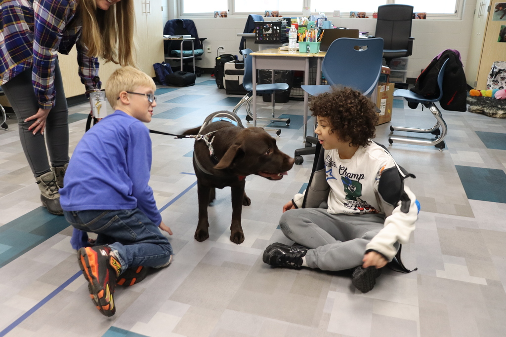 Therapy Dog meets two students