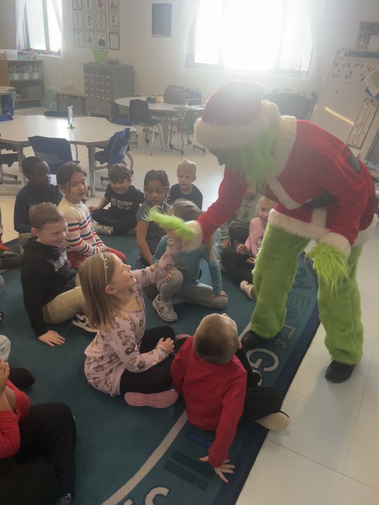 Grinch giving a high five 