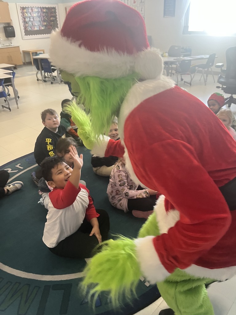 Grinch giving a high five
