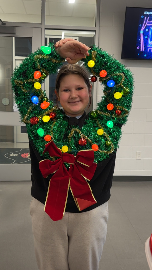 Girl in holiday wreath sweater