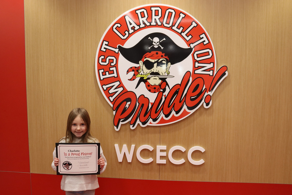 girl holding proud pirate certificate