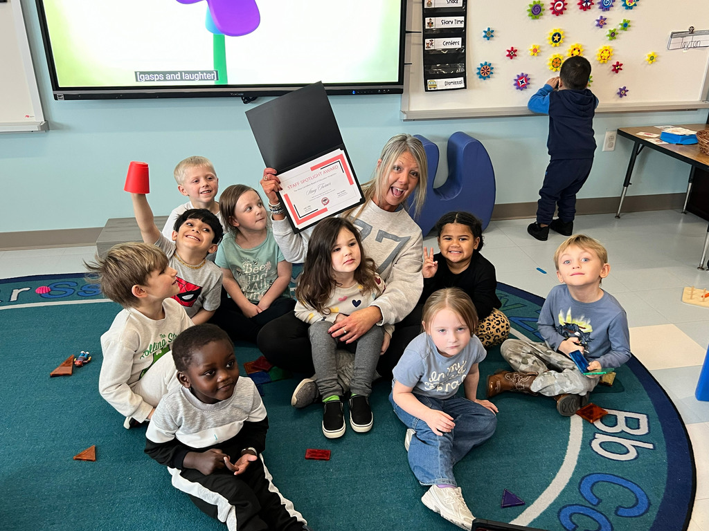 woman sitting on floor with children