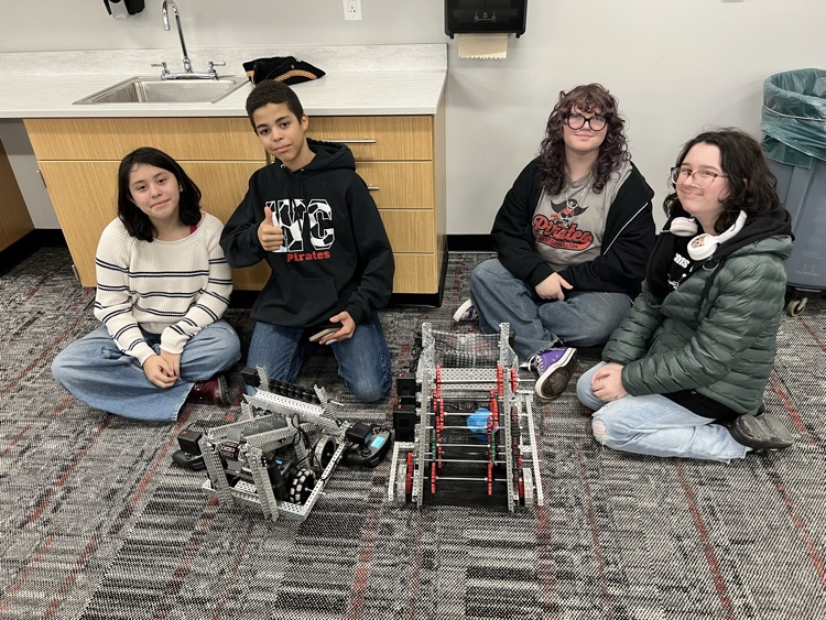 students with a robot